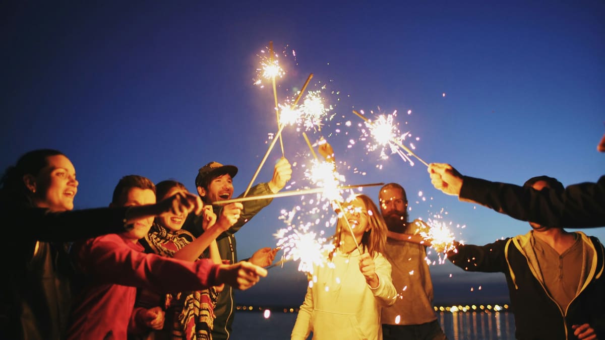 Friends celebrating with sparklers